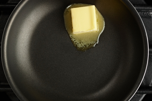 Butter melting in a non stick pan.