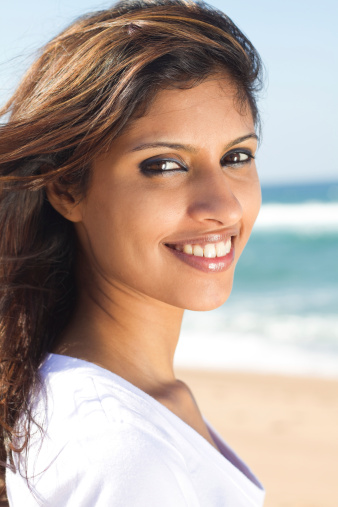 young pretty modern arabian woman on beach