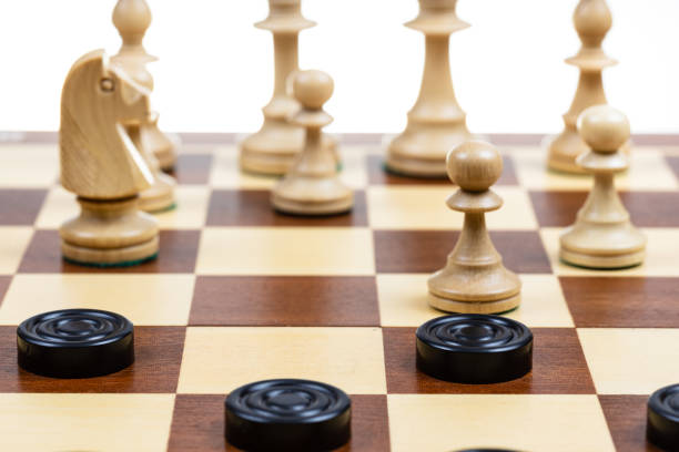 istock gameplay of chess and checkers on board closeup 1468234083