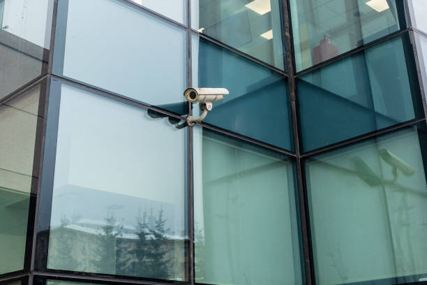 istock outdoor security camera on green glass wall 1468234316