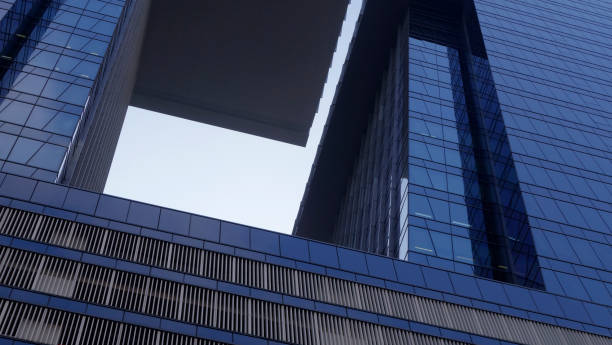 istock Close-Up modern glass building architecture on the blue sky background.copy space for layout. 1468235294