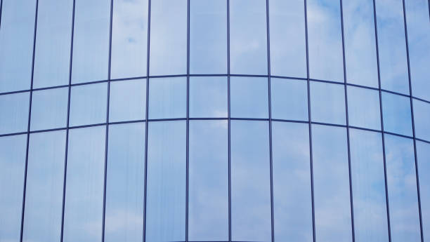 istock Close-Up modern glass building architecture on the blue sky background.copy space for layout. 1468235300