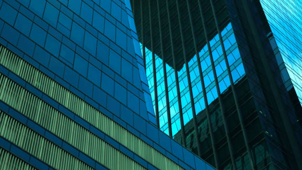 istock Close-Up modern glass building architecture on the blue sky background.copy space for layout. 1468235323