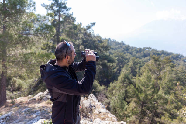 istock Portrait of men looking through binoculars 1468236013