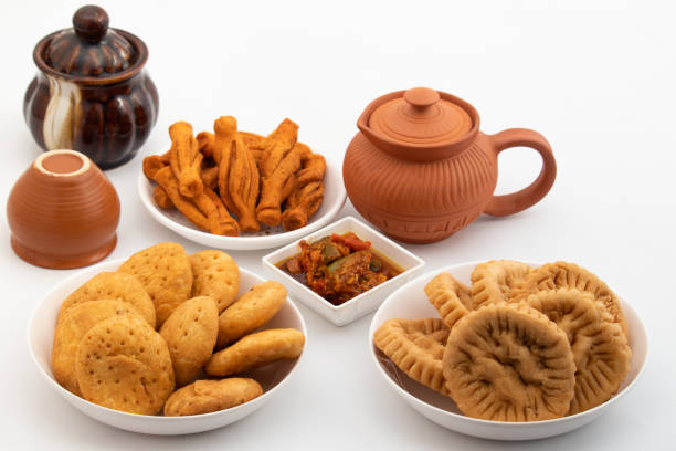 istock Different Variety Of Namkeen Masala Mathri, Karela Matthi, Plain Mathi Also Called Mathiya, Farsi Poori, Farsan, Pharsa Or Mathari With Achaar And Chai. Festive Special For Diwali, Holi, Karwa Chauth 1468236631