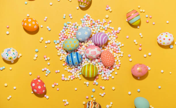 istock Happy easter Colourful of Easter eggs on yellow background. Greetings and presents for Easter Day celebrate time. Flat lay ,top view. 1468239839