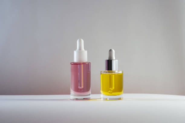 istock pink and yellow face and hair oils 1468241513