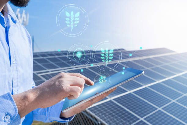 istock Unrecognizable engineer with a tablet with eco holograms in photovoltaic solar panel system plant. 1468242556