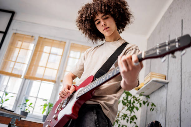 istock Young boy plays rock on gutar 1468243443