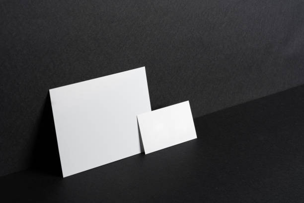 istock White businesscards on black background close up 1468243640