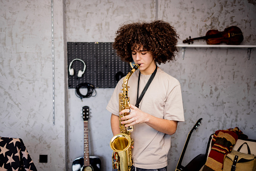 Young boy play saxophone