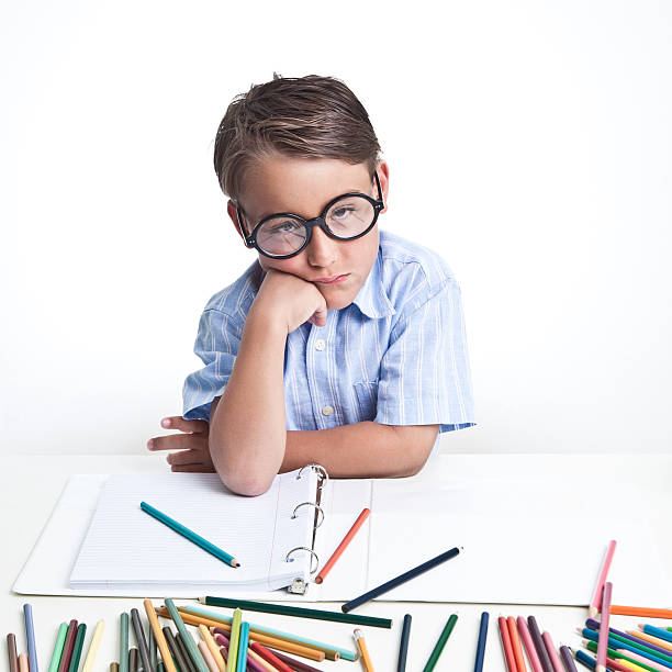 istock bored kid with color pencils 146824476
