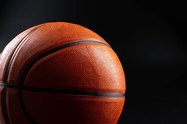 istock Basketball ball close up on dark black background 1468244886