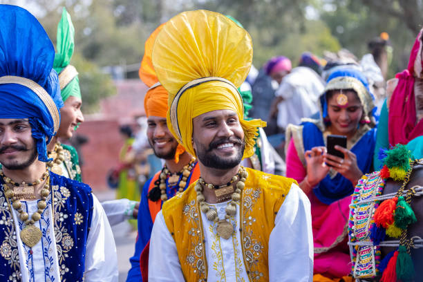 Male sikh artist performing bhangra dance stock photo