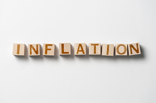 the inflation word made on the wooden cubes, concept of economy and investment
