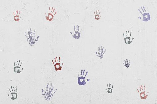 wall with palm handprints, creative art design, symbol of human personality