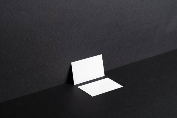 istock White businesscards on black background close up 1468247933