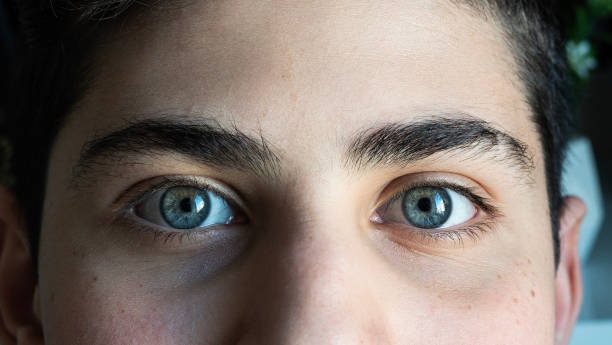 istock Close-up Blue eyed boy looking at camera 1468248322