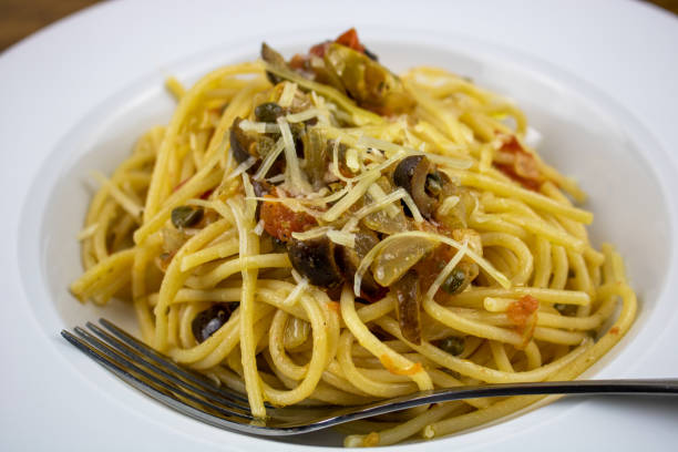 istock Spaghettini with Caper, Olive, & Tomato Sauce 1468248344