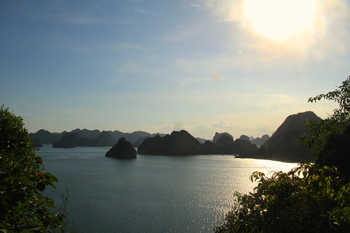 the cluster of limestone islands in Halong bay has a unique appearance, taking in sunset