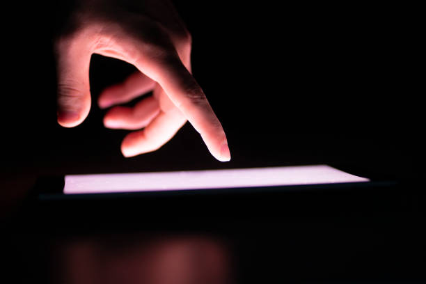 istock human hand touching the screen and push the button on mobile device 1468249911