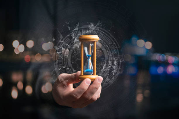 time management concept, businessman holding hourglass time management concept, businessman holding hourglass how much time stock pictures, royalty-free photos & images