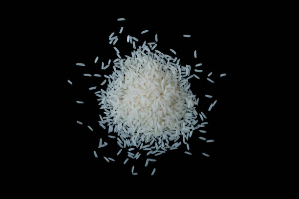 istock Heap of rice on a black background 1468259940