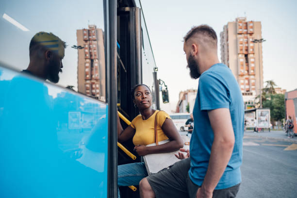 istock Multiracial friends entering the bus together 1468261869