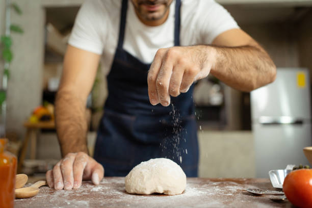 man making pizza. - dough sphere kneading bread imagens e fotografias de stock