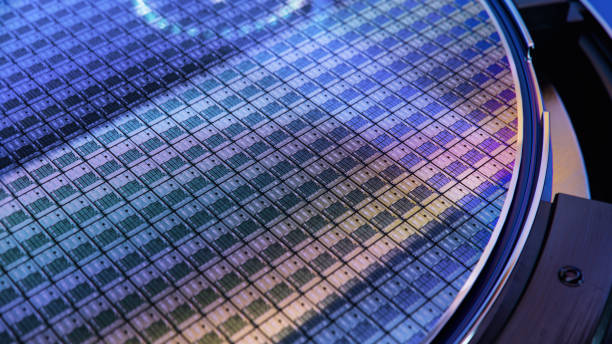 istock Macro Shot of Computer Chips on Silicon Wafer during Semiconductor Manufacturing at Fab or Foundry. Semicondutor Wafer Texture. 1468266105