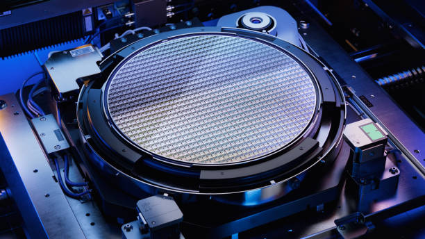 istock Top View of Silicon Wafer during Photolithography Process inside Complex Computer Chip Production Machine. Semiconductor Manufacturing at Fab or Foundry. 1468266116