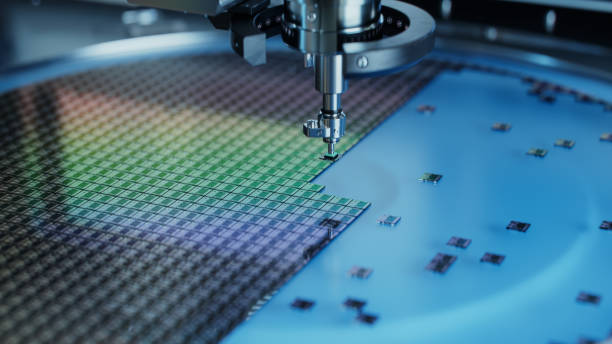Silicon Dies are being Extracted by a Pick and Place Machine from Wafer and Attached to Substrate. Computer Chip Manufacturing at Factory. Close-up of Semiconductor Packaging Process.