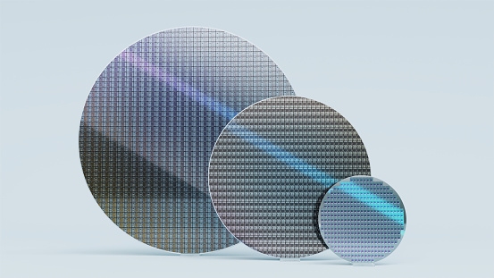 Set of Three Silicon Wafers of Different Sizes for Semiconductor Production, 300mm, 200mm and 100mm, on White Background
