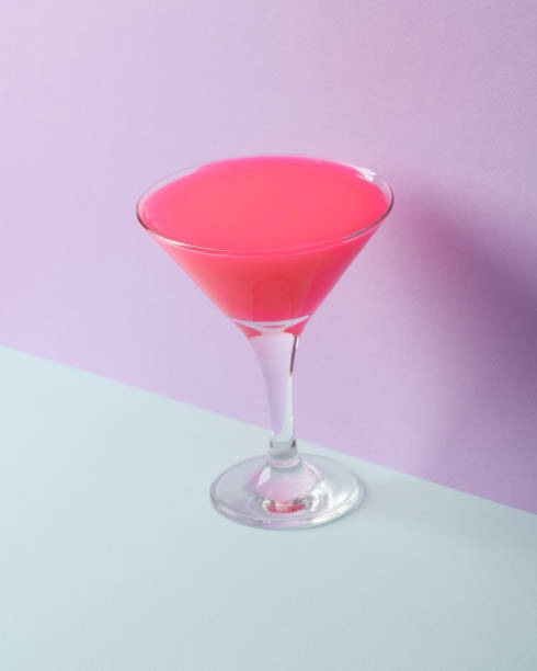 istock Creative layout, cocktail glass with neon slime on two tone pastel background. Visual trend. Minimalistic aesthetic still life. Party concept. Fresh idea 1468267411