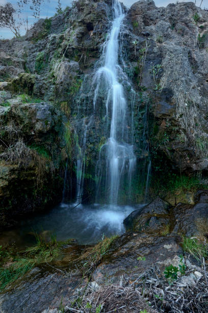 istock Small waterfalls in a mountain stream on a sunny day 1468268319