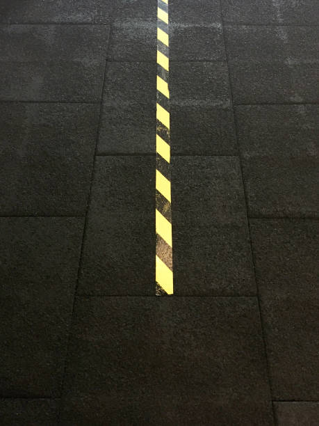 High angle view barricade tape on the rubber flooring