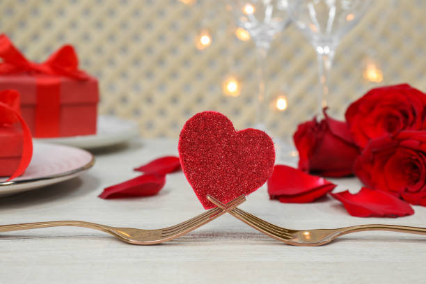 istock Forks and decorative heart on white table. Romantic place setting 1468273199