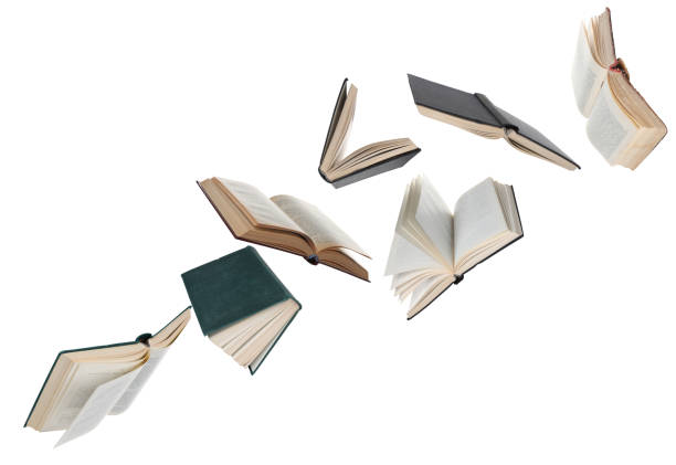 istock Many hardcover books flying on white background 1468273271