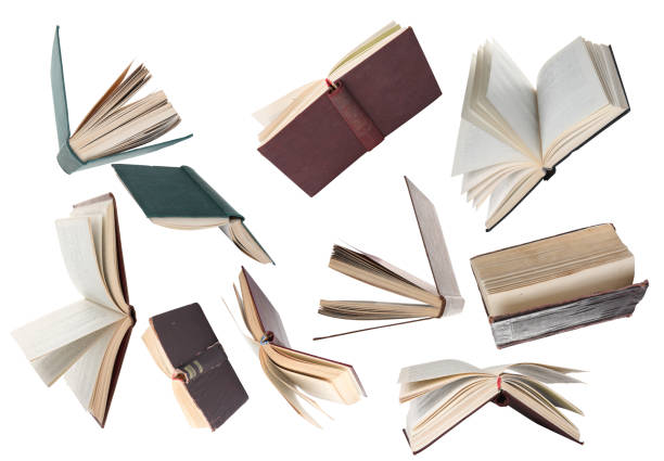 istock Many hardcover books falling on white background 1468273273