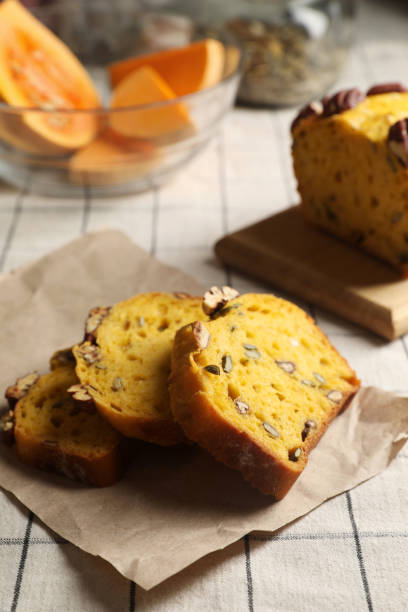istock Delicious pumpkin bread with pecan nuts on tablecloth 1468273401