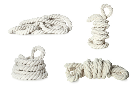 Set with bundles of cotton ropes on white background
