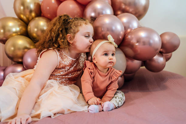 istock Two adorable sisters together at home 1468274853