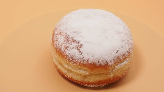 Freshly baked and powdered German donuts.