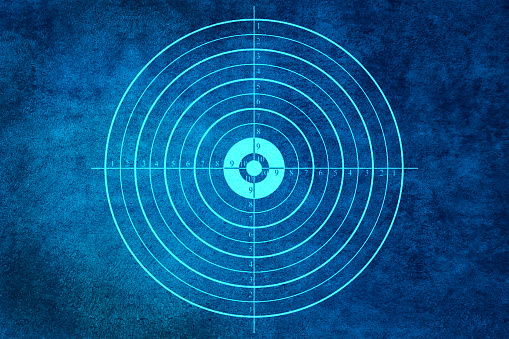 Target sign on blue abstract background. Business goal concept.