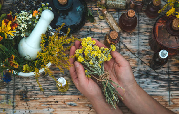 istock Woman with medicinal herbs and tinctures. Selective focus. 1468276640