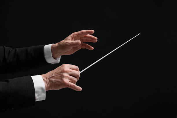 istock Professional conductor with baton on black background, closeup 1468276881