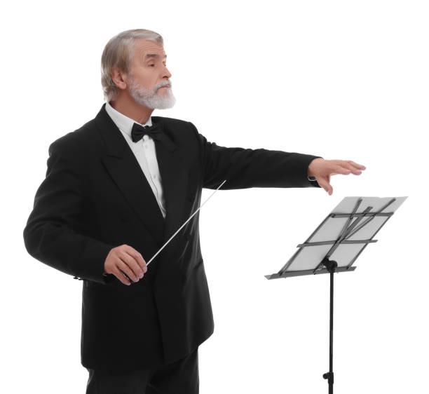 Professional conductor with baton and note stand on white background