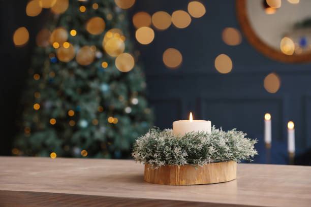 istock Beautiful burning candle with Christmas decor on wooden table, space for text 1468277433