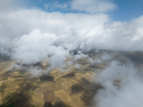 Fields covered with clouds. Taken via drone. Kayseri, Turkey.