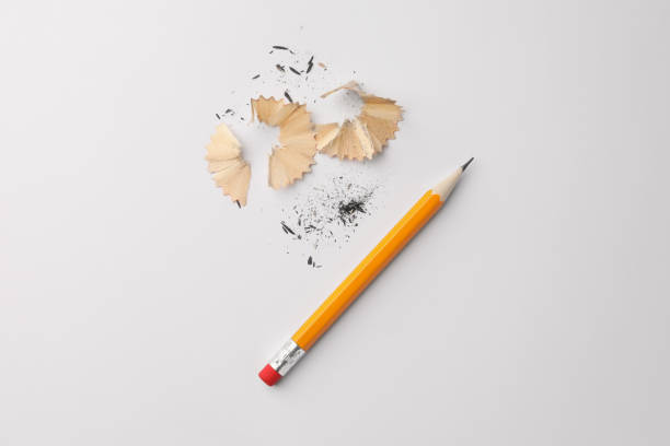 istock Graphite pencil and shavings on white background, flat lay 1468279519